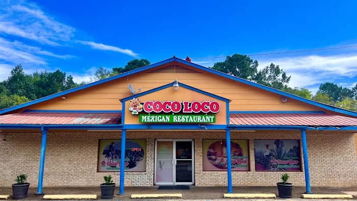Front entrance of Coco Loco with orange facade, blue trim, and Coco Loco sign